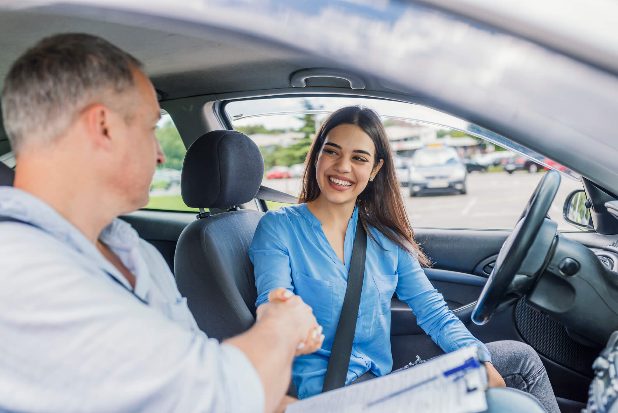 Driving school car with instructor and student